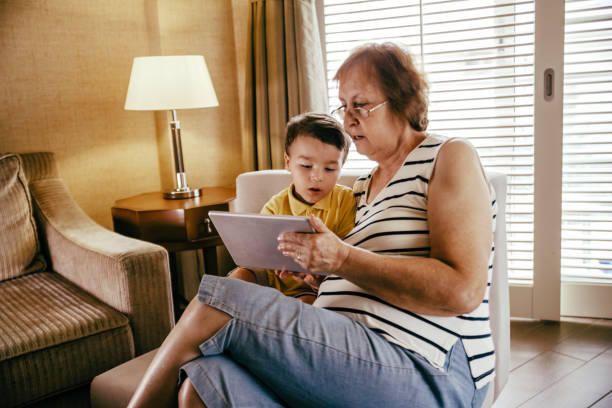 istock Grandmother and grandchild using digital tablet 1144680629