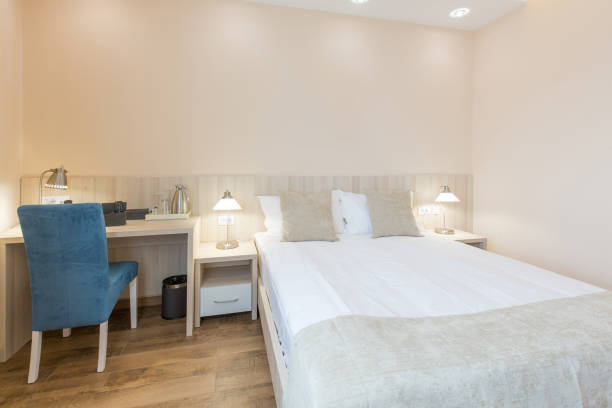 istock Interior of a double bed hotel bedroom 1144681813