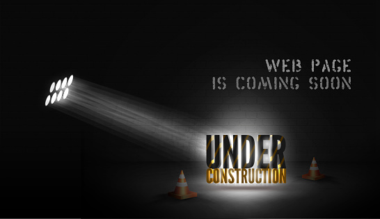 Web page poster Under construction with 3d text in spotlight on scene with cones on black background