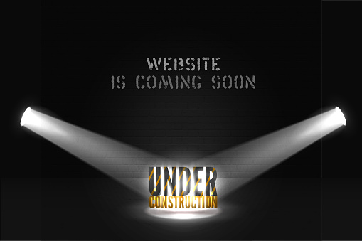Web site poster Under construction with 3d text in searchlight on scene. coming soon and spotlights on black background. Web page dark banner with shiny lights.