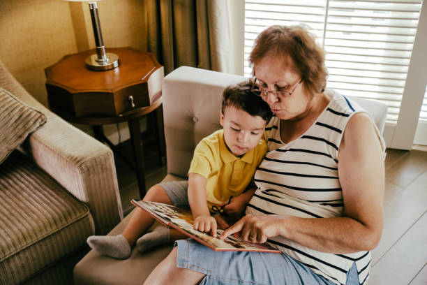 istock Grandmoter reading a book for her small grandson 1144684747