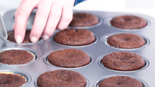 istock Cooling freshly baked chocolate cupcakes on a cooling rack. 1144692492