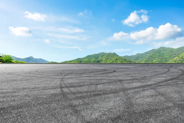 istock Empty asphalt race track and green mountains natural landscape 1144699273