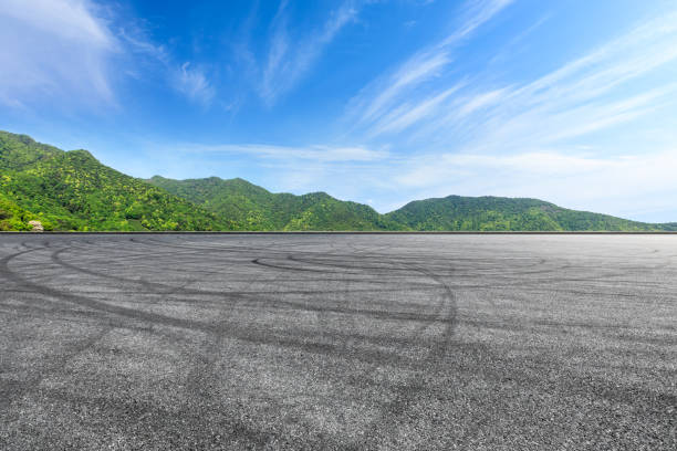 istock Empty asphalt race track and green mountains natural landscape 1144699982