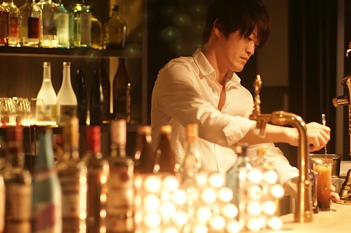 Young man working at a bar,Japan