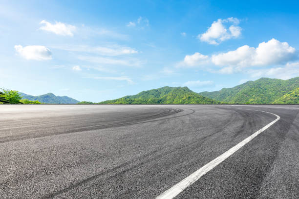 istock Empty asphalt race track and green mountains natural landscape 1144700017