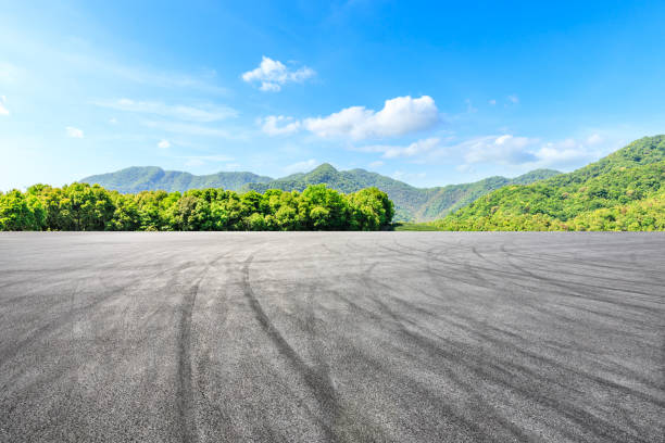 istock Empty asphalt race track and green mountains natural landscape 1144700055