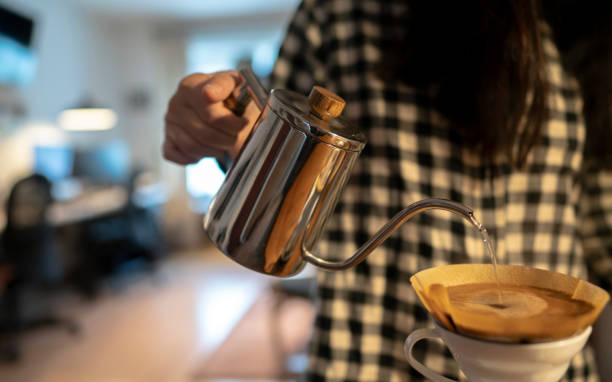istock girl making coffee with coffee filter 1144700125