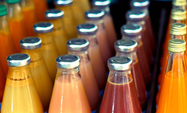 Vibrant Bottles of Juice Lined Up, Close-Up stock photo