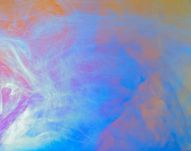 istock Multicolor abstract background, close up view. Blurred background. Abstract acrylic clouds in water. Acrylic paint dissolving into water. Ink mixing with liquid, abstract colourful pattern. 1144706679
