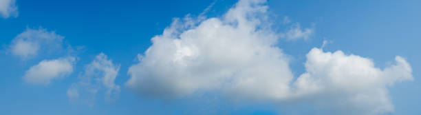 istock Beautiful panoramic vivid vibrant blue sky with white clouds on a sunny day for web banner. 1144708456