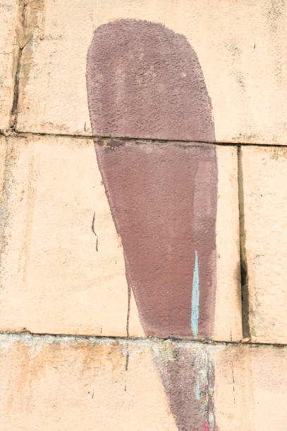 istock Black paint streaks on the gray wall 1144709781