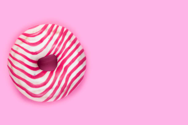 istock Pink donut on a wooden background. 1144713953