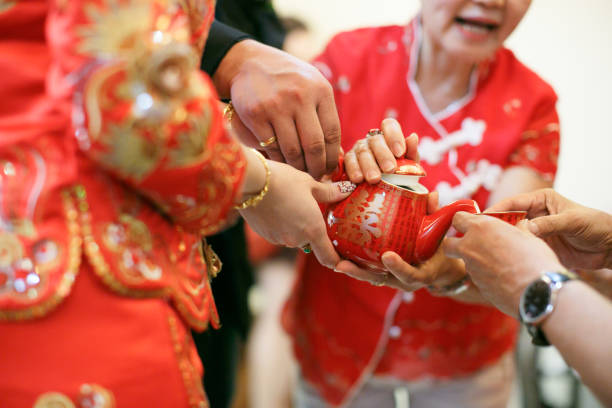 istock Newlywed serving tea to elder on Chinese traditional tea ceremony 1144716417