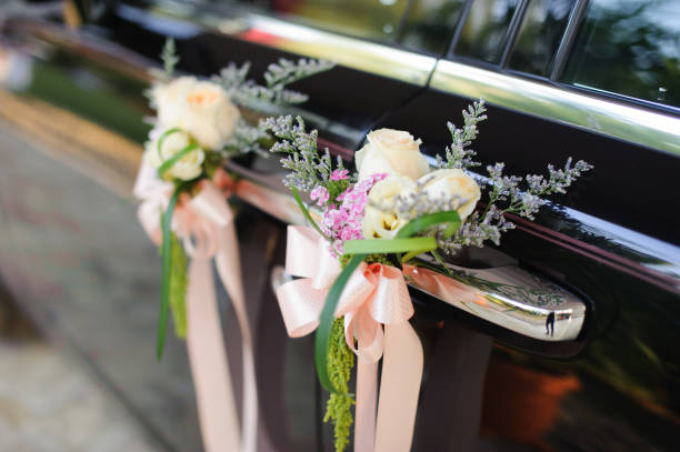 istock Floral wedding decoration on car door 1144716447