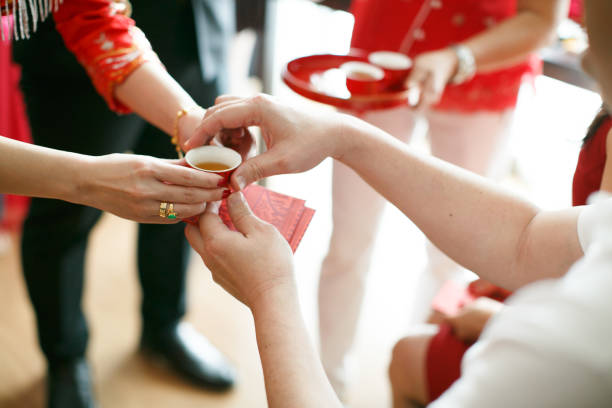 istock Newlywed serving tea to elder on Chinese traditional tea ceremony 1144716561