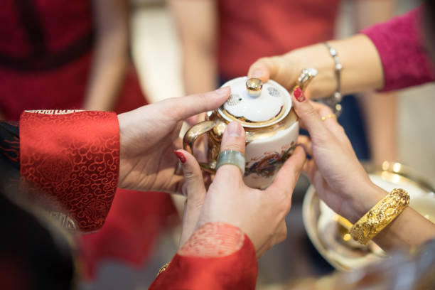istock Newlywed serving tea to elder on Chinese traditional tea ceremony 1144716572