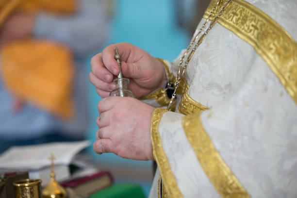 istock The priest's hands hold a church attribute.Preparing for the church service 1144722859