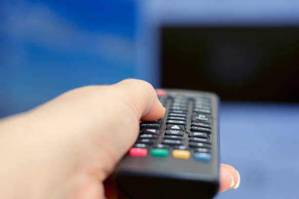 istock Remote control in hand. Smart tv. Tv remote control. 1144723807