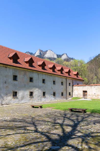 Red Monastery, Slovakia - April 20, 2019:  14th century Red Monastery, courtyard surrounding wall and view on Three Crowns Massif