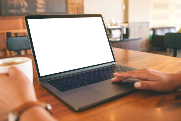 istock a woman using and touching on laptop touchpad with blank white desktop screen 1144727785