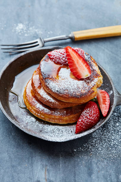 istock Pancakes with strawberries and sugar 1144728232