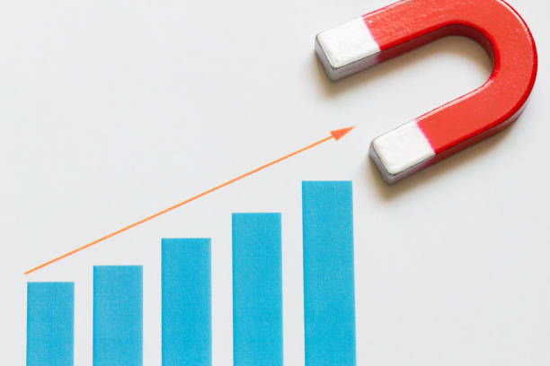 istock Increase business money with chart and magnet abstract 1144728300