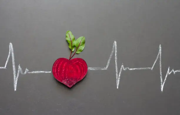 Photo of Healthy beetroot with heart shape and juice