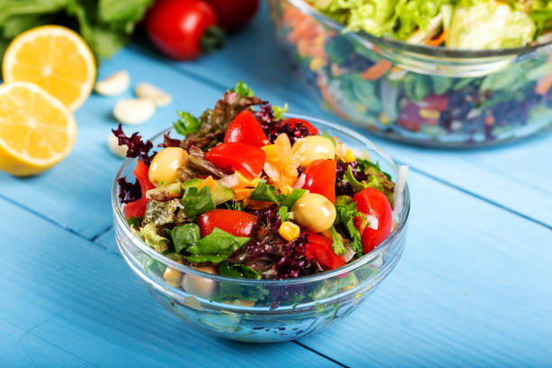 istock Fresh mixed vegetables salad in a bowl 1144729574
