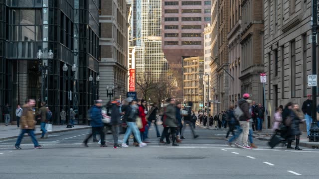 4K Time lapse of crowd unrecognizable people and traffic around area of Boston old state house at the twilight time, Massachusetts, USA downtown skyline, Architecture and building with tourist concept.