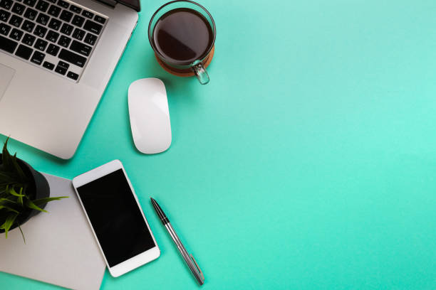 istock Pastel office desk table with laptop, and supplies. Top view with copy space, flat lay. - Image 1144732986