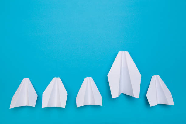 istock winner  paper aircraft on blue background - Image 1144733437