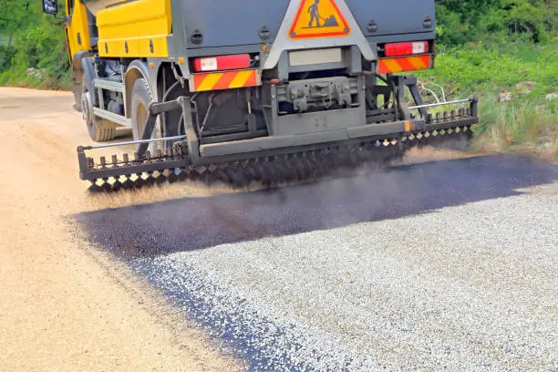 Tar derived from petroleum is used in public works for asphalting roads. It is dispersed in successive layers on gravel.