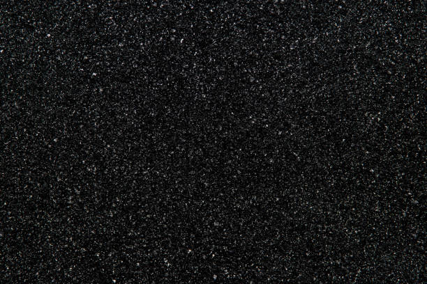 Black abstract background. The texture of black stone (minerals) crumb. Black abstract background. Top view. granite rock stock pictures, royalty-free photos & images