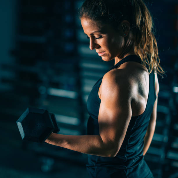 istock Woman Exercising At Gym 1144743665