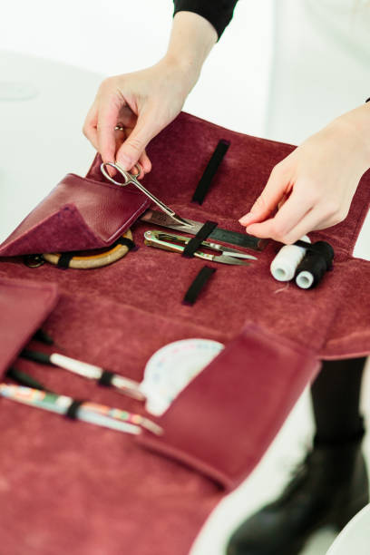istock sewing kit accessories in pink cover and machine 1144749893