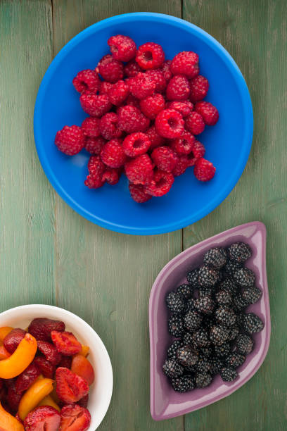 istock raspberries on a plate. raspberries on wooden background. raspberry top view 1144750230
