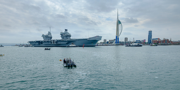 Portsmouth, UK - June 10, 2018: HMS QUEEN ELIZABETH - the Royal Navy's newest and largest ever warship - sails from Portsmouth for only the second occasion, this time heading for the USA for first of class flying trials and warm weather sea trials