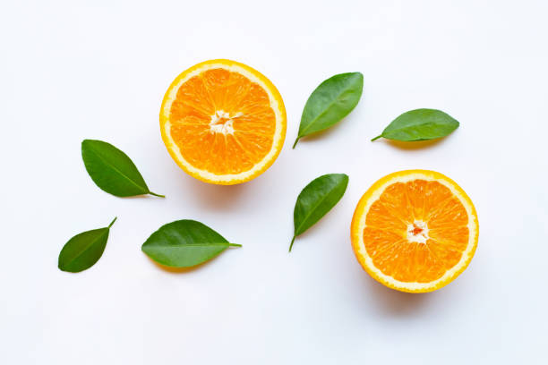 istock Fresh orange citrus fruits with leaves on white 1144753081