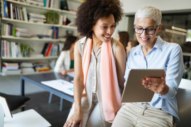 istock Group of successful business people at work in office 1144753545