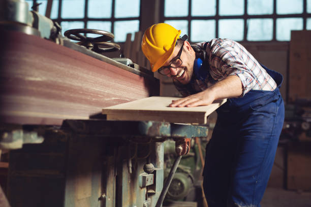 istock Carpenter working on woodworking machines in carpentry shop 1144753620