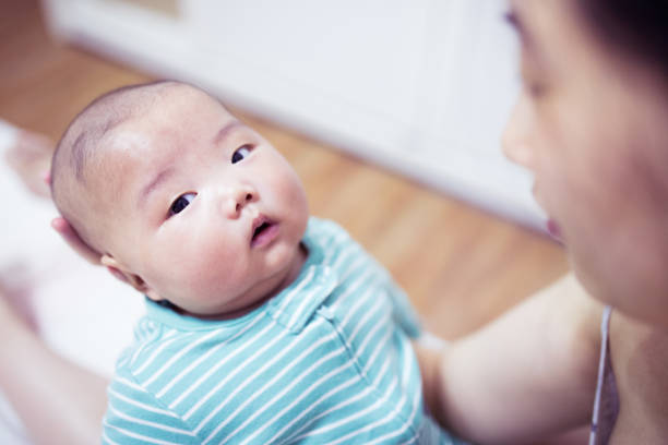 istock Mother hands holding newborn baby 1144754063