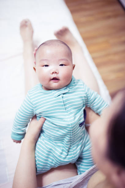 istock Mother hands holding newborn baby 1144754676