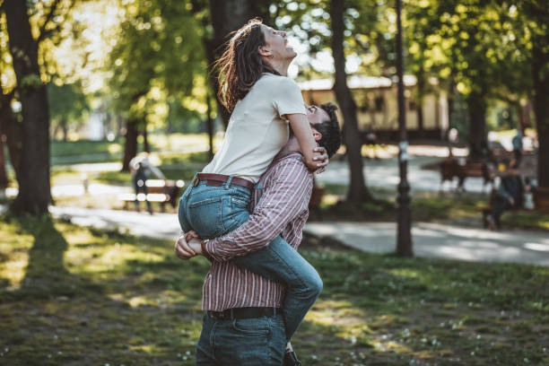 istock Young Couple is Enjoying Springtime in Park 1144755999