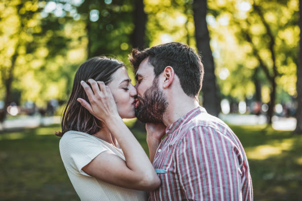 istock Young Couple is Enjoying Springtime in Park 1144756772