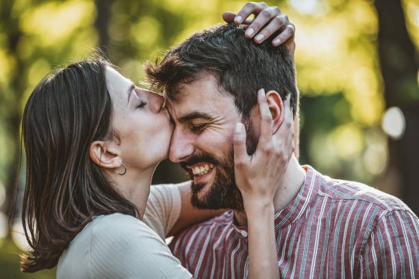 istock Young Couple is Enjoying Springtime in Park 1144757095