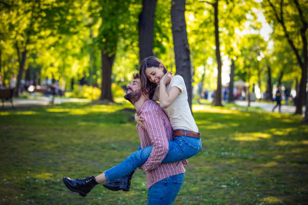 istock Young Couple is Enjoying Springtime in Park 1144757101