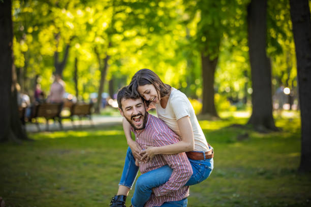 istock Young Couple is Enjoying Springtime in Park 1144757258