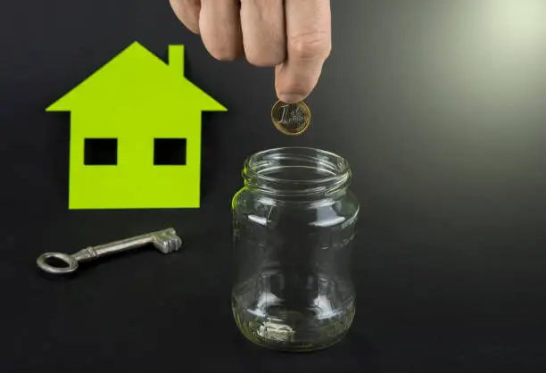 Green house save money. A jar with euro or dollar