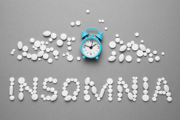 istock Sleeping pills and an alarm clock, insomnia concept. Night depression, anxiety 1144760081